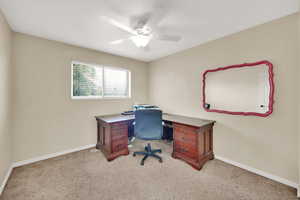 Office space featuring light colored carpet and ceiling fan