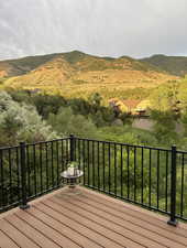 Wooden deck featuring a mountain view