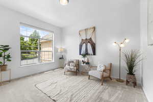 Living area with carpet floors and baseboards