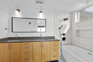 En suite bathroom for primary bedroom