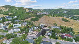 Aerial view of property's location with nearby suburban area