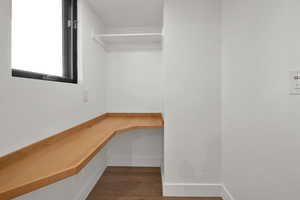 Spacious closet with wood finished floors