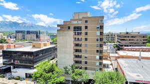 View of building exterior with a mountain view and a city view