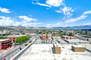 View of mountain background featuring nearby urban area