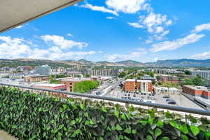 Balcony featuring a city view and a mountain view