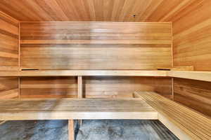 Sauna / steam room with wooden walls and wood ceiling