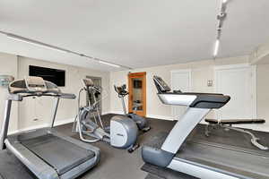 Exercise area featuring baseboards