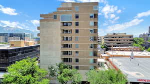 View of property with a mountain view and a city view