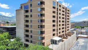 View of apartment building / complex featuring a mountain view