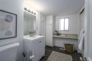 Bathroom with vanity and wood finished floors