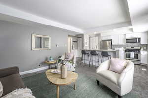 Living area featuring baseboards