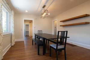 Dining area with original hard wood flooring, recessed lighting