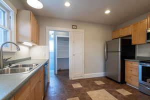 Upstairs Kitchen with stainless steel appliances, light wood cabinets, and recessed lighting