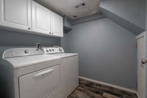 Laundry area featuring melamine cabinets and tile floors