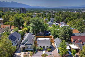 Aerial perspective of suburban area with a mountainous background