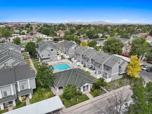 Aerial perspective of suburban area with a pool