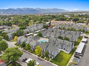 Aerial view of residential area featuring a mountainous background