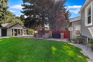 Back yard with a Studio/Workshop/Office and Patio