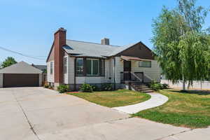 View of front of home with a detached 2 car garage