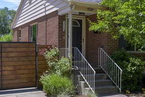 Entrance to property with brick siding