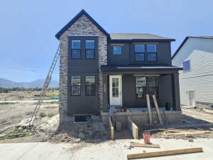 View of front of property featuring a porch and a mountain view