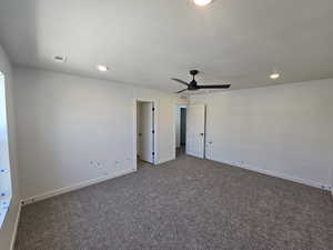 Unfurnished bedroom with carpet, a textured ceiling, recessed lighting, and a ceiling fan