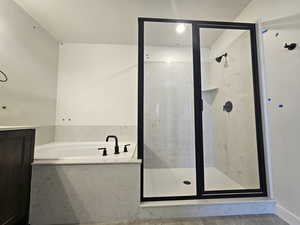 Full bath with a garden tub and a shower stall