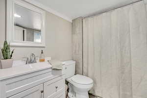 Bath with vanity and curtained shower