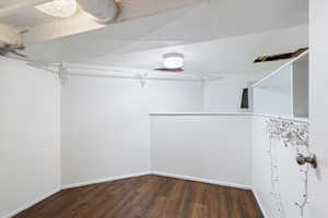 Walk in closet featuring wood finished floors
