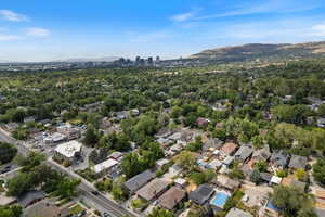 Aerial overview of property's location featuring a mountain backdrop