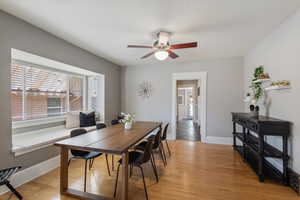 Dining space featuring light wood-type flooring and ceiling fan