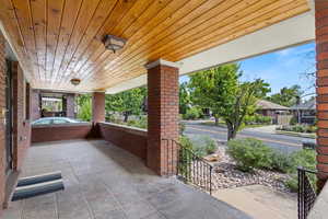 View of patio / terrace with a jacuzzi