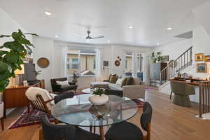 Dining area featuring light wood finished floors, stairway, recessed lighting, and a ceiling fan