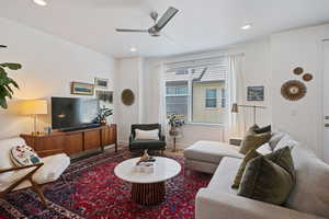 Living room featuring ceiling fan and recessed lighting
