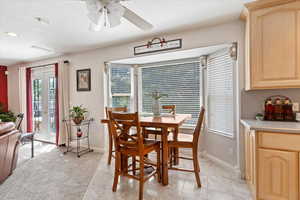 Dining area featuring ceiling fan, recessed lighting, and light marble finish floors