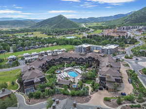 Aerial view of property's location with a mountainous background