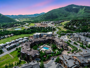 View of property location with a water and mountain view and a local golf course