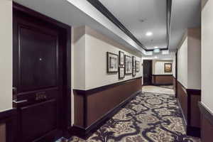 Hall featuring recessed lighting and crown molding