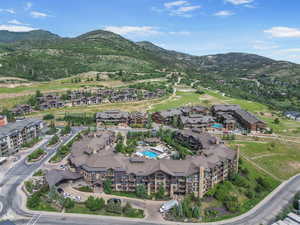 Aerial view of property's location featuring mountains