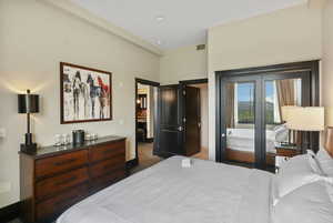 Carpeted bedroom with baseboards