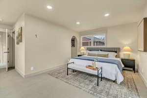 Bedroom featuring light carpet and recessed lighting