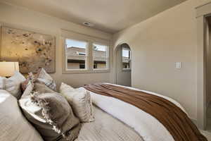 Bedroom with arched walkways
