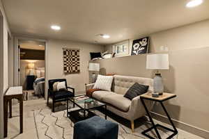 Living room featuring recessed lighting and light carpet