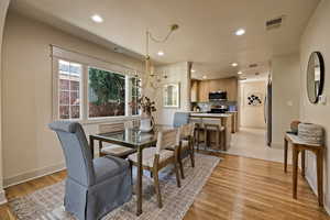 Dining area featuring recessed lighting and light wood-style flooring
