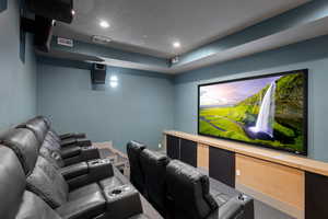 Cinema room featuring recessed lighting and carpet flooring