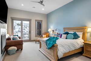 Bedroom with access to outside, light colored carpet, recessed lighting, and ceiling fan