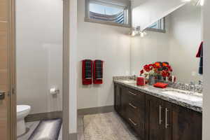 Bathroom featuring double vanity and tile patterned floors