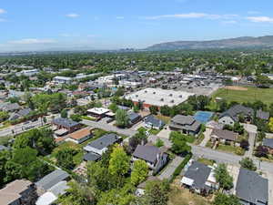 Aerial view of property and surrounding area with mountains