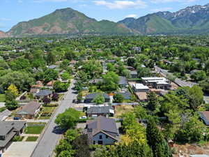 Aerial perspective of suburban area with a mountain backdrop