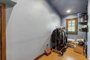 Workout area with wood finished floors and recessed lighting